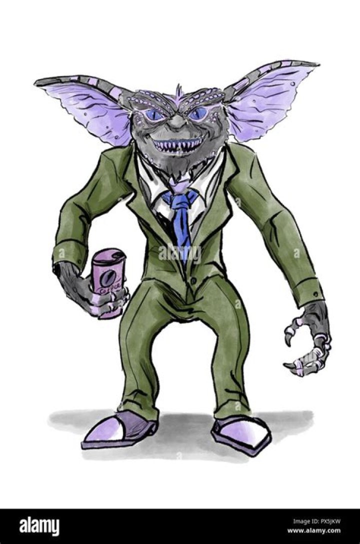 a gremlin in a suit drinking coffee Stock Photo Alamy